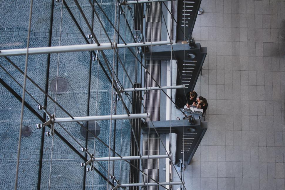 Free Image of Couple Standing on Top of Building 