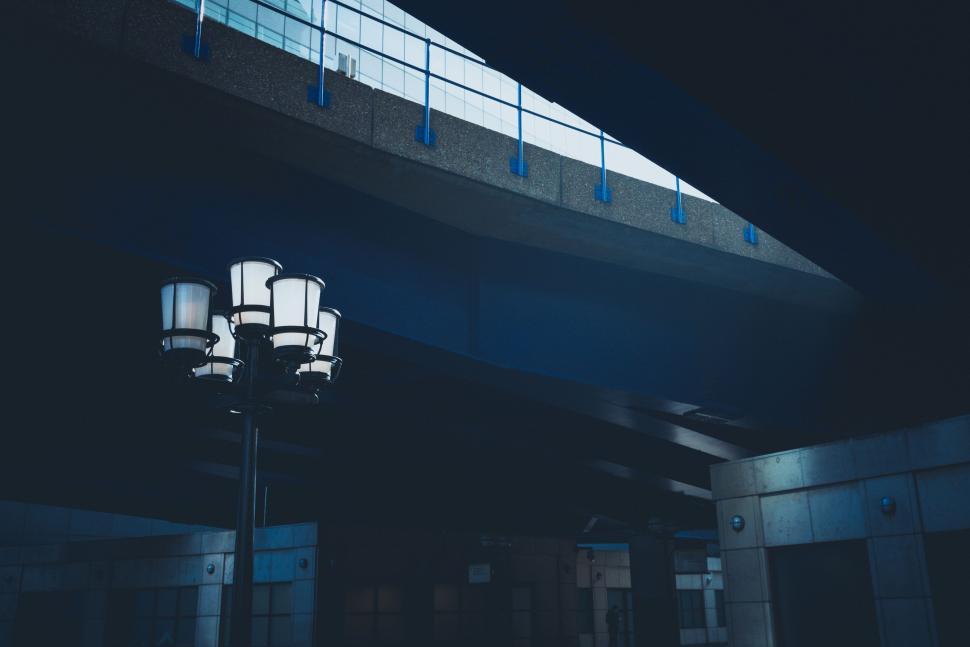 Free Image of Street Light Illuminated Under Bridge at Night 