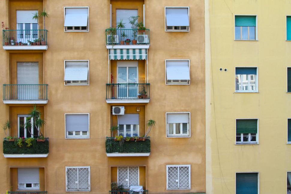 Free Image of Modern High-Rise Building With Numerous Windows and Balconies 