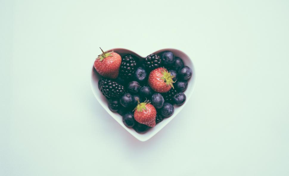 Free Image of Heart Shaped Bowl Filled With Berries and Blueberries 