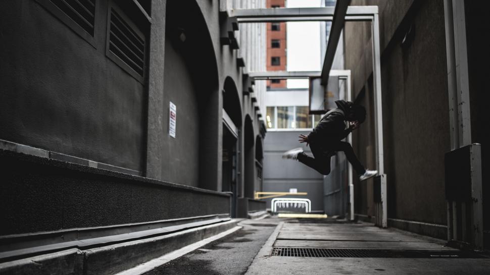 Free Image of Person Jumping in the Air on a Skateboard 