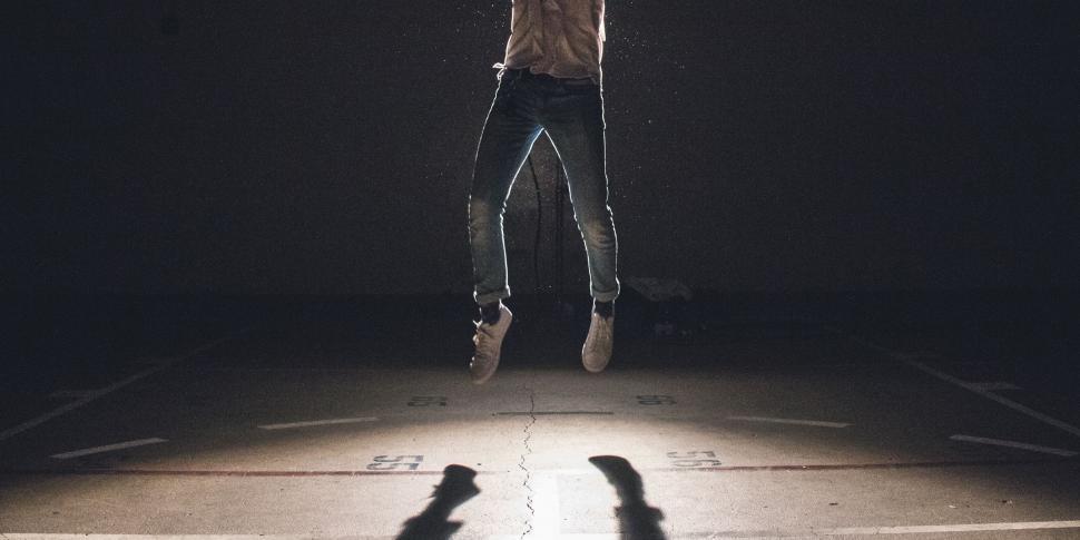 Free Image of Person Jumping in the Air With a Skateboard 