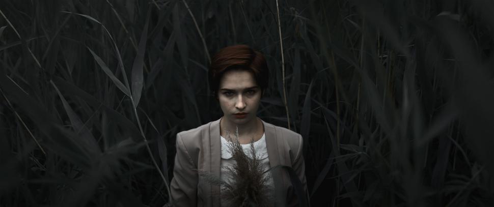Free Image of Man Standing in Tall Grass Field 