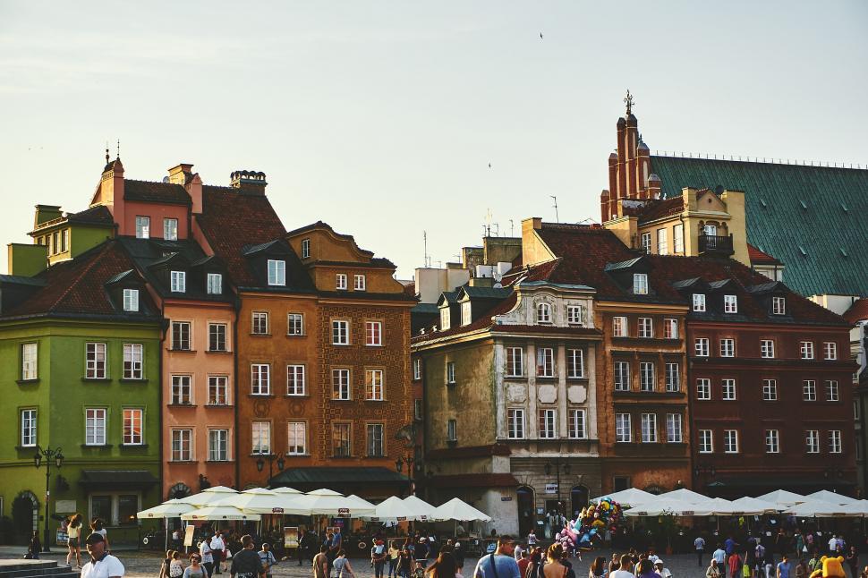 Free Image of Group of People Walking Around City Square 