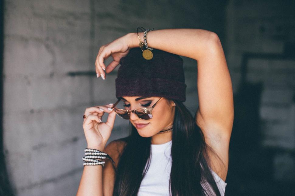 Free Image of Woman Wearing Beanie and Sunglasses 