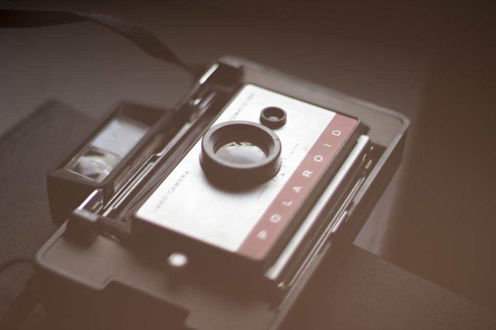 Free Image of Camera and Cell Phone on Table 