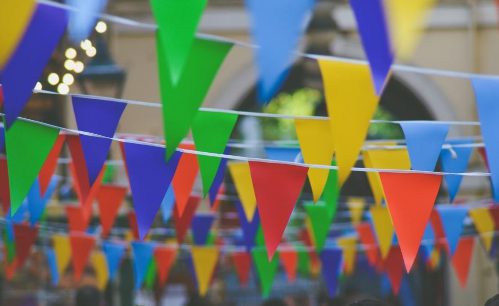 Free Image of Colorful Flags Hanging From a Line 