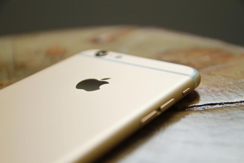 Free Image of Iphone on Wooden Table 