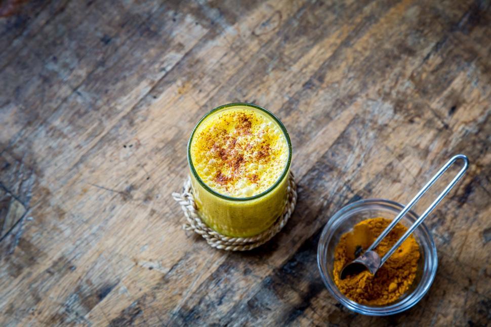 Free Image of Wooden Table With Two Cups Filled With Food 