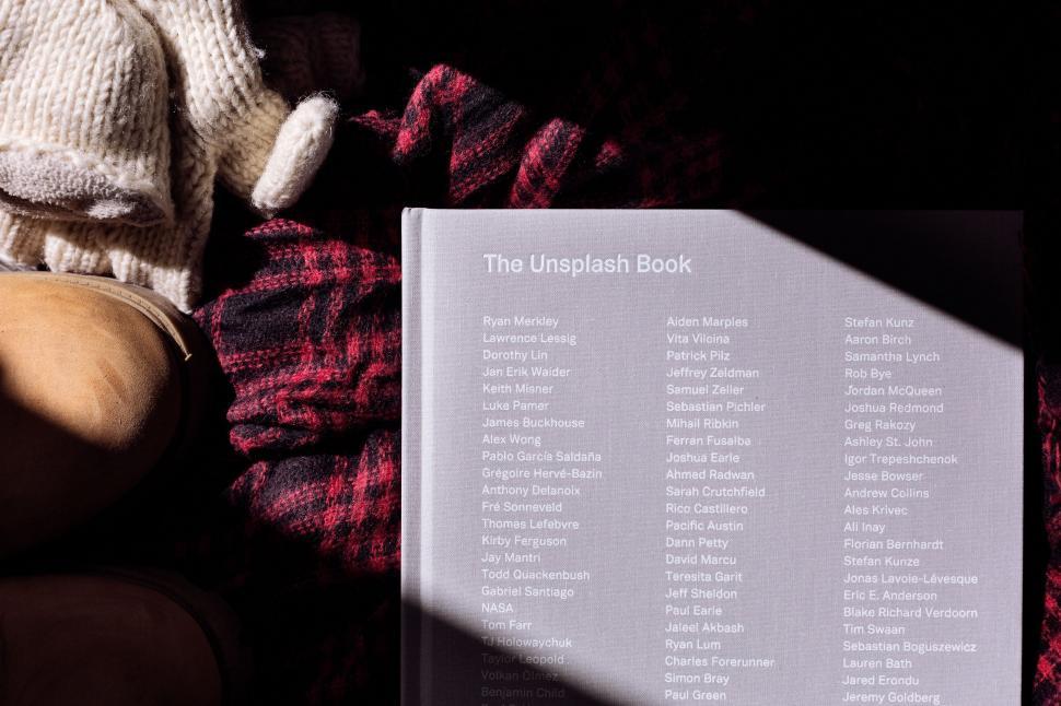 Free Image of Teddy Bear Sitting Next to a Book 