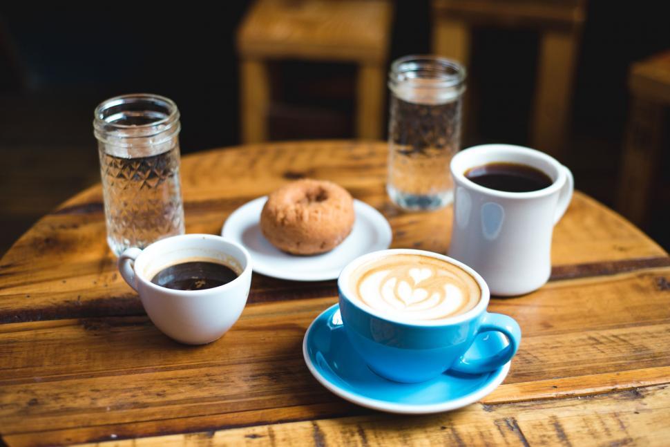 Free Image of Two Cups of Coffee on Wooden Table 