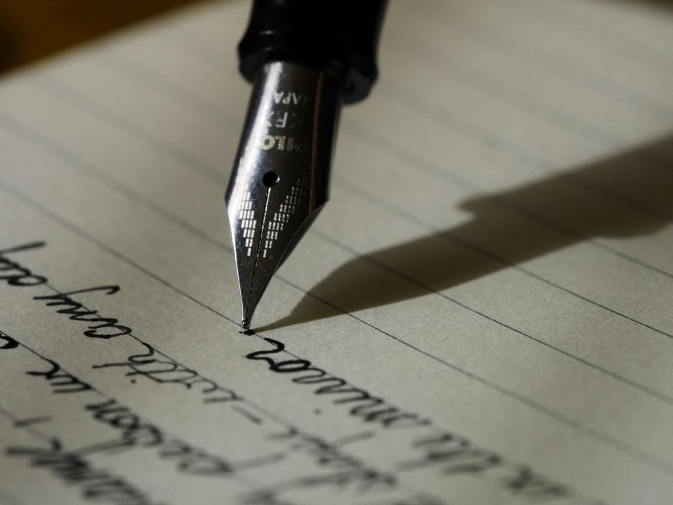 Free Image of Pen on Top of Paper 