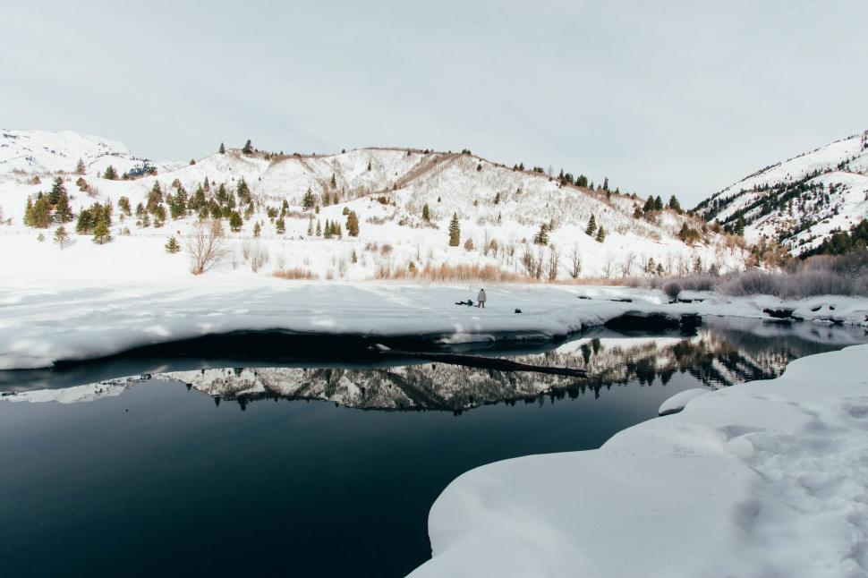 Free Image of Man Skiing Down Snow Covered Slope 