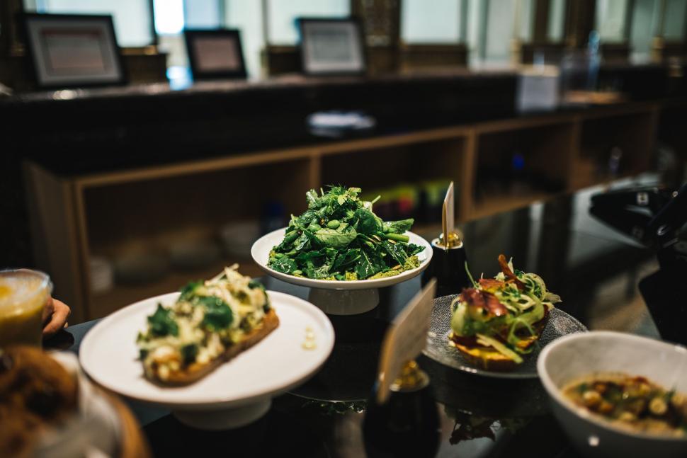 Free Image of Table Set With Plates of Food and Bowls of Salad 