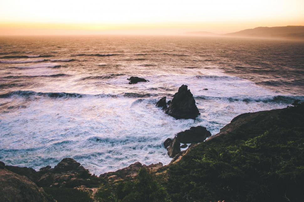 Free Image of View of a Body of Water With Rocks in the Foreground 