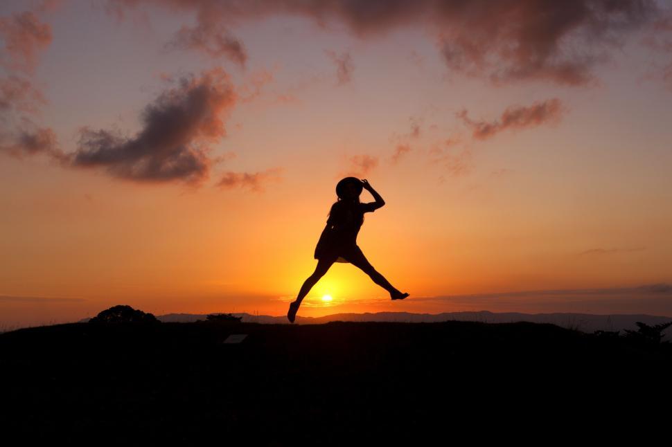 Free Image of Person Jumping in the Air at Sunset 