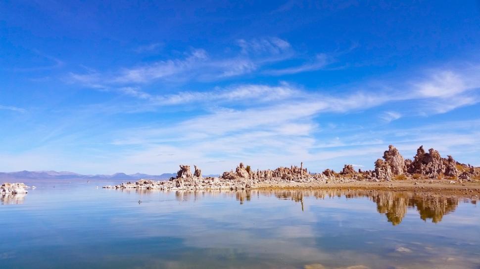 Free Image of Large Body of Water Surrounded by Rocks 