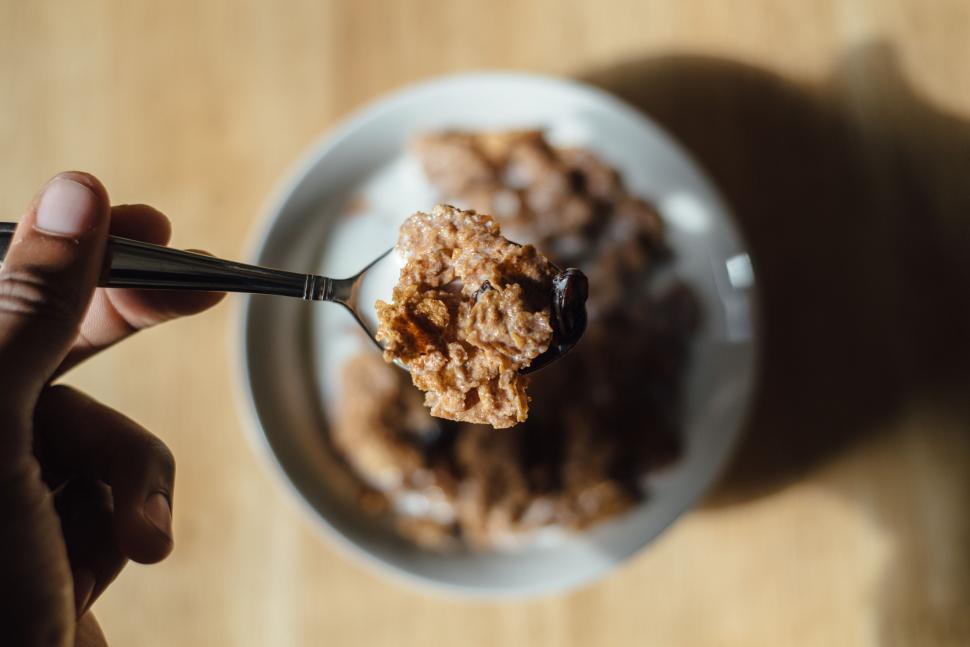 Free Image of Person Holding Spoon Full of Oatmeal 