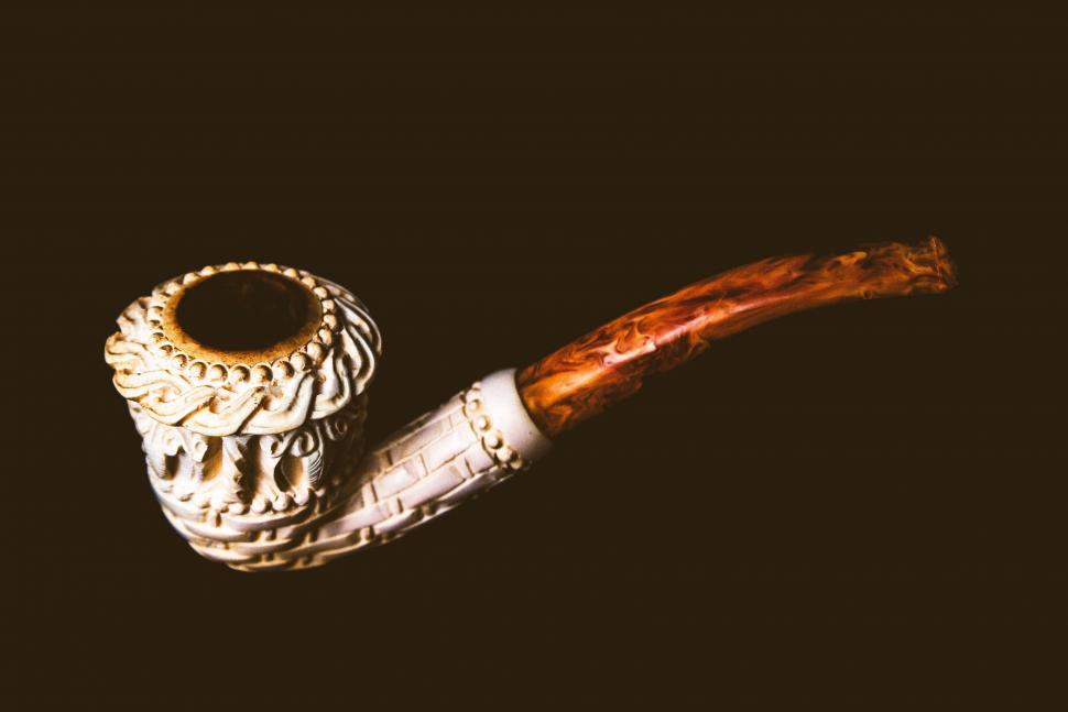 Free Image of Pipe Resting on Table 