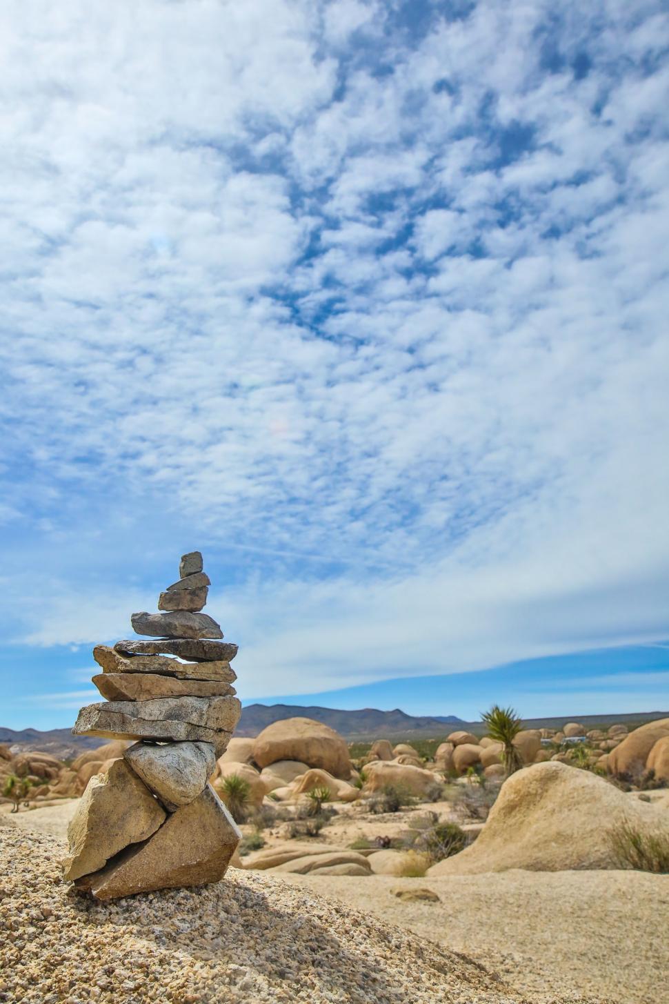 Free Image of Pile of Rocks on Sandy Beach 