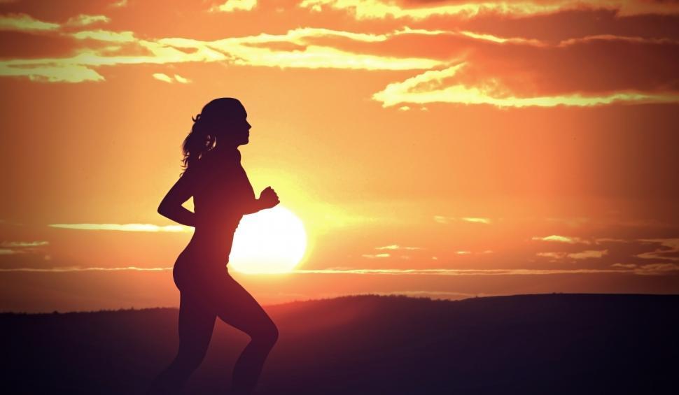 Free Image of Young Woman Jogging at Sunset - Fitness and Health 