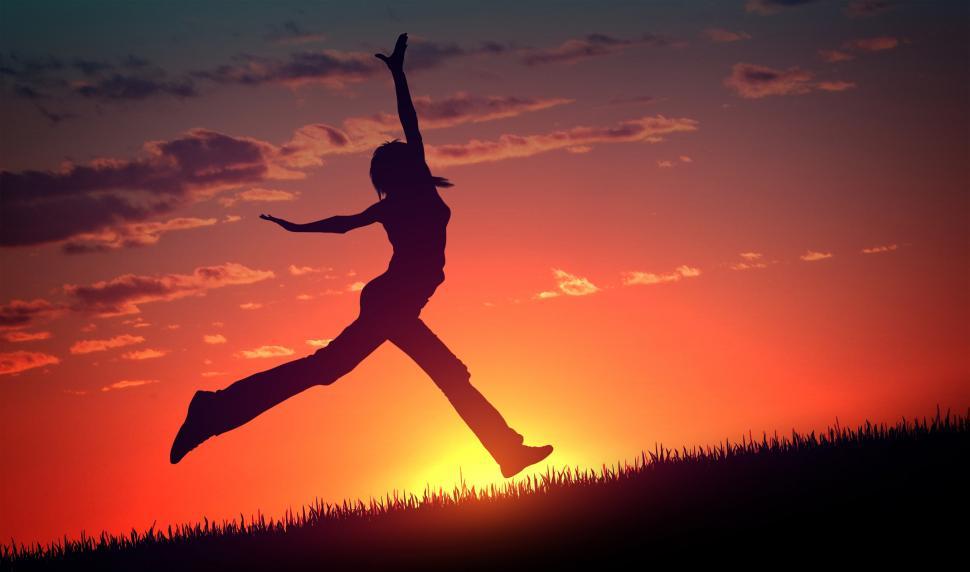 Free Image of Joy and Happiness - Young Woman Jumps at Sunset 