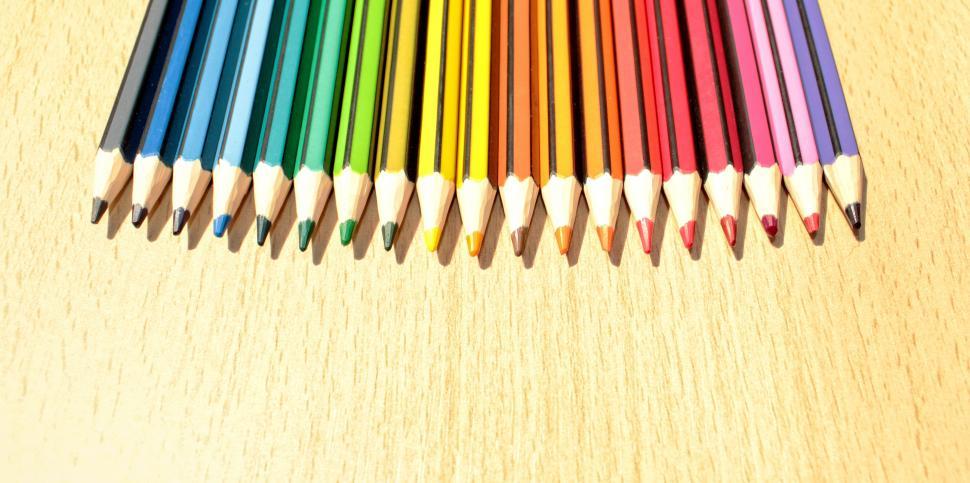 Free Image of Colorful Pencils in a Row with Copyspace 