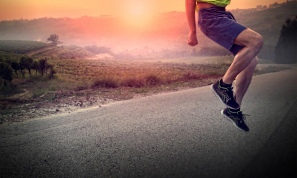 Free Image of Warming Up - Male Athlete Performing Squat Jumps at Sunrise 