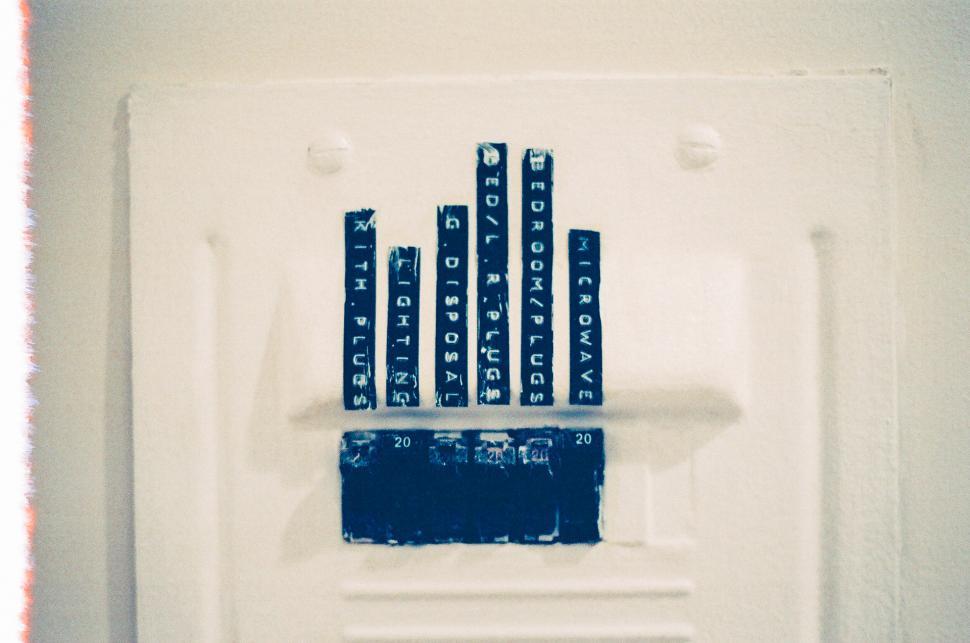 Free Image of White Wall Covered With Black Letters 