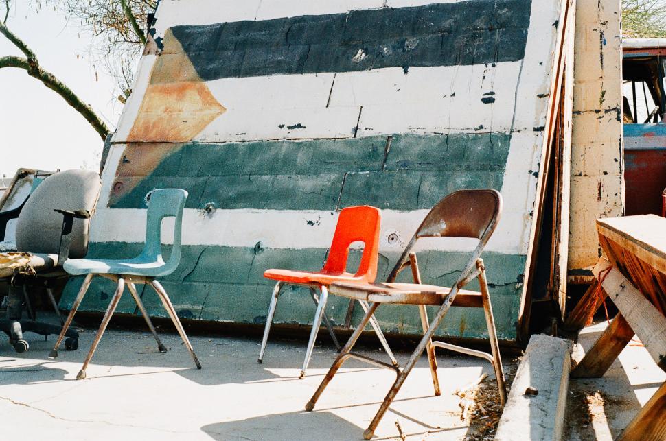 Free Image of Two Chairs Next to Boat 