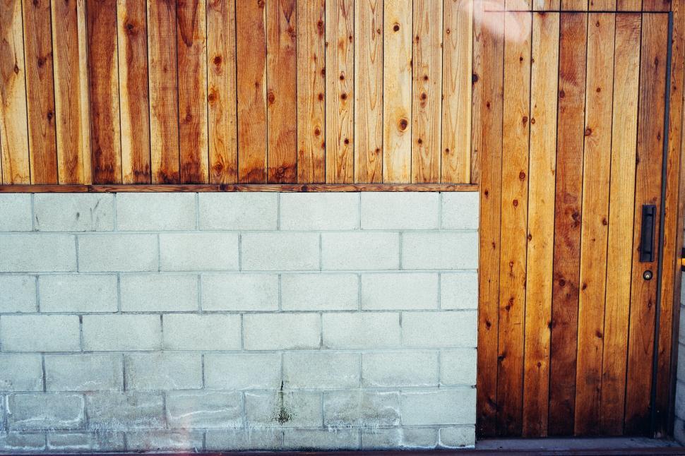 Free Image of Skateboard Leaning Against Brick Wall 