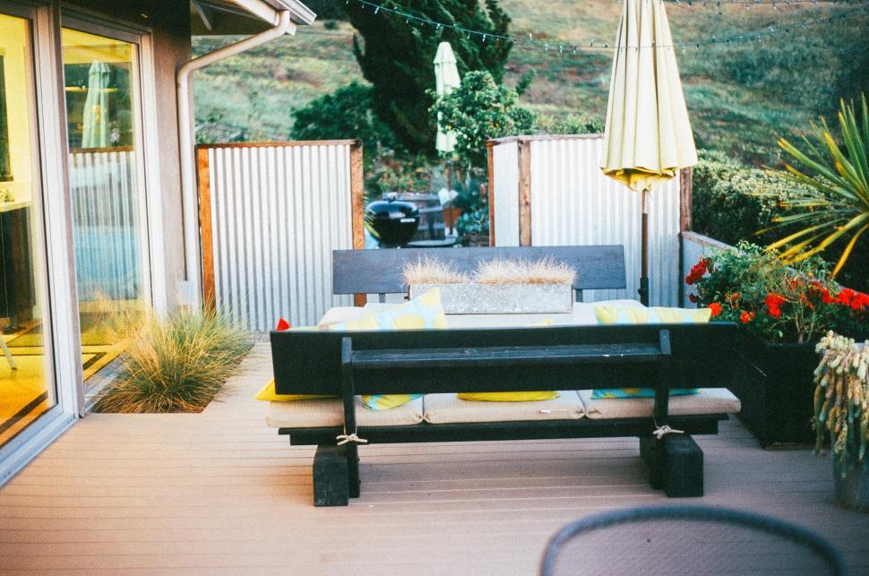 Free Image of Patio With Table, Chairs, and Umbrella 