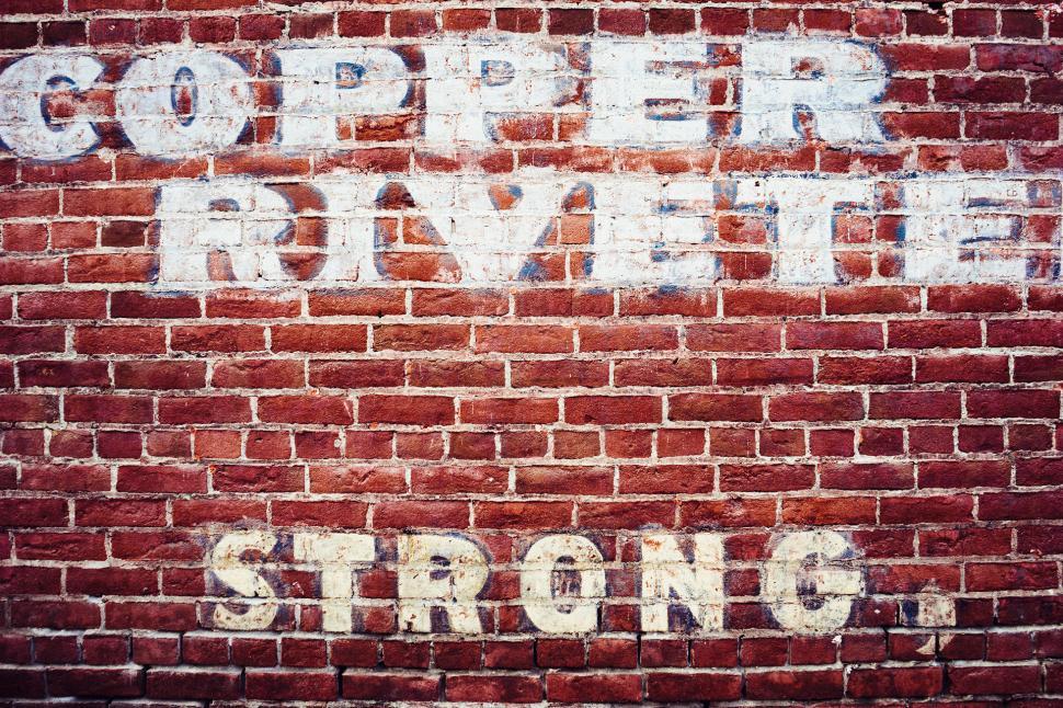 Free Image of Brick Wall With Sign 