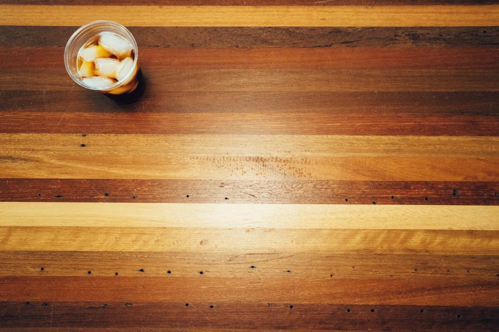 Free Image of Glass of Ice Tea on Wooden Table 