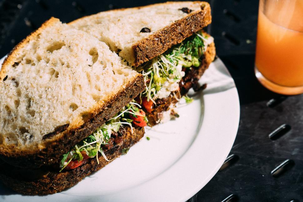 Free Image of Sandwich and Orange Juice on Plate 