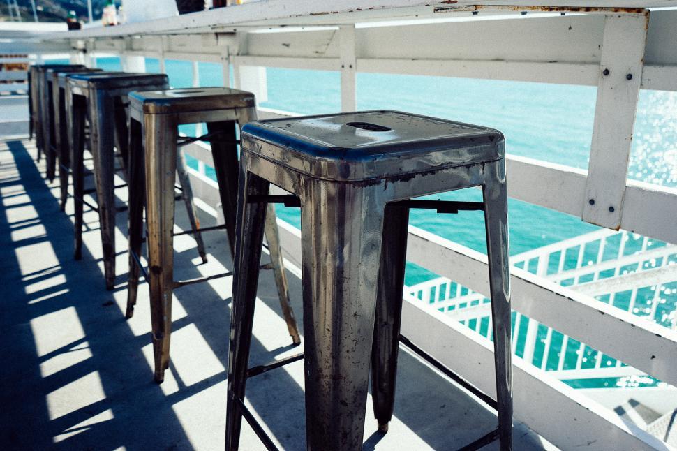 Free Image of Metal Stools on Pier 