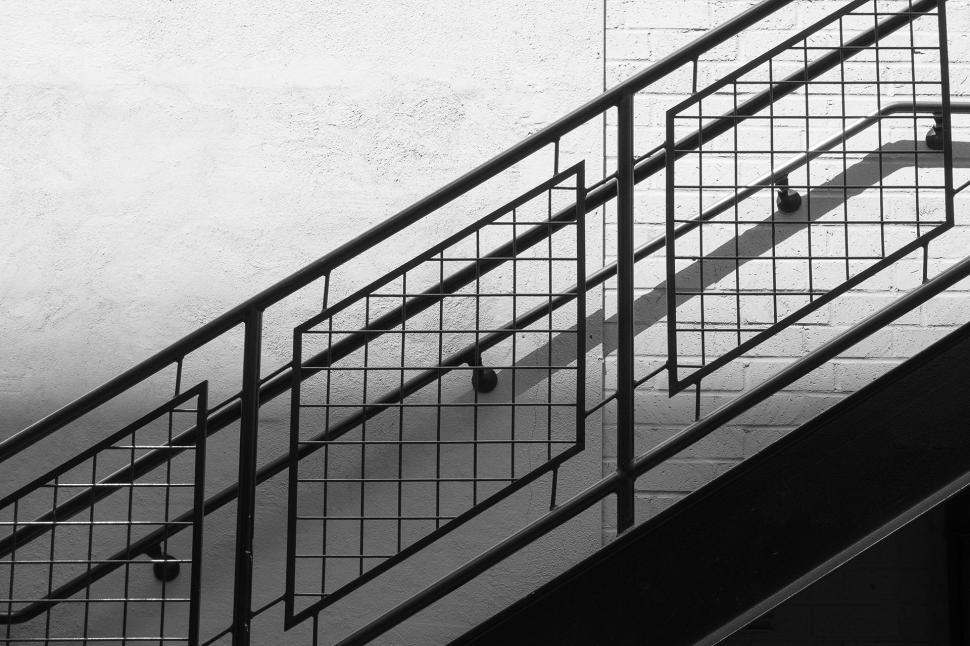 Free Image of Man Riding Skateboard Down Metal Handrail 