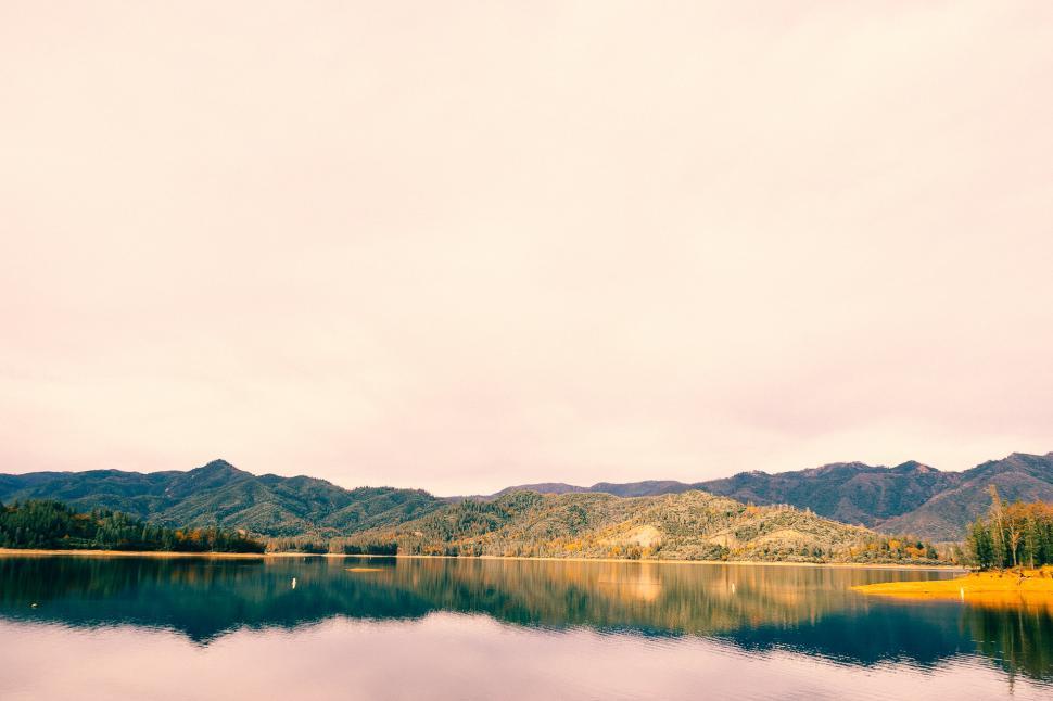 Free Image of Majestic Lake Surrounded by Towering Mountains 