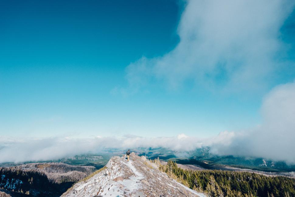 Free Image of Person Standing on Snow Covered Mountain 