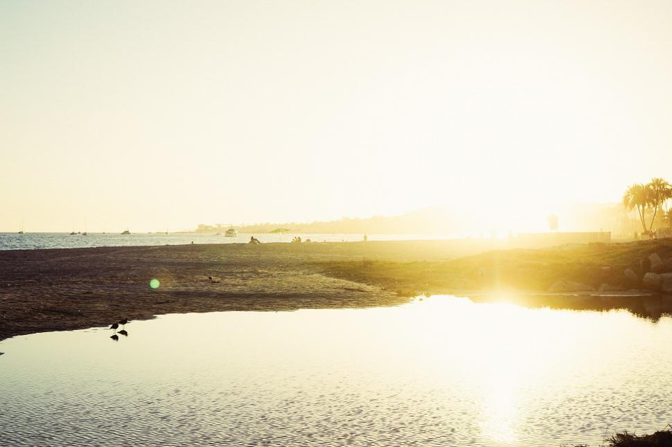 Free Image of Person Standing on Beach by Body of Water 