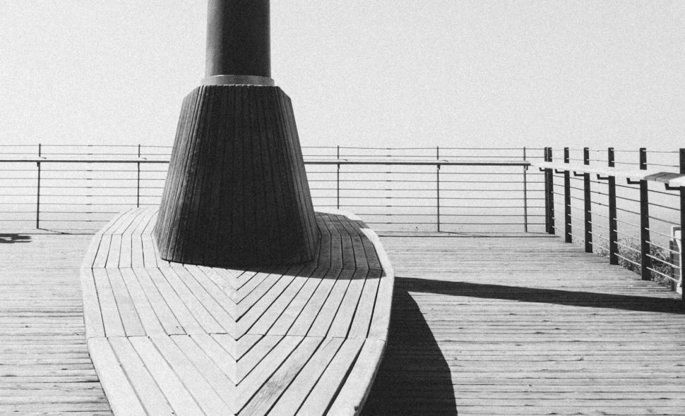 Free Image of Wooden Pier Stretching Into the Water 