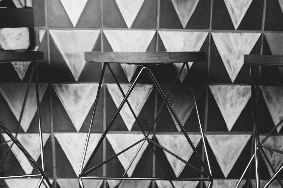 Free Image of Black and White Photo of Bar Stools 