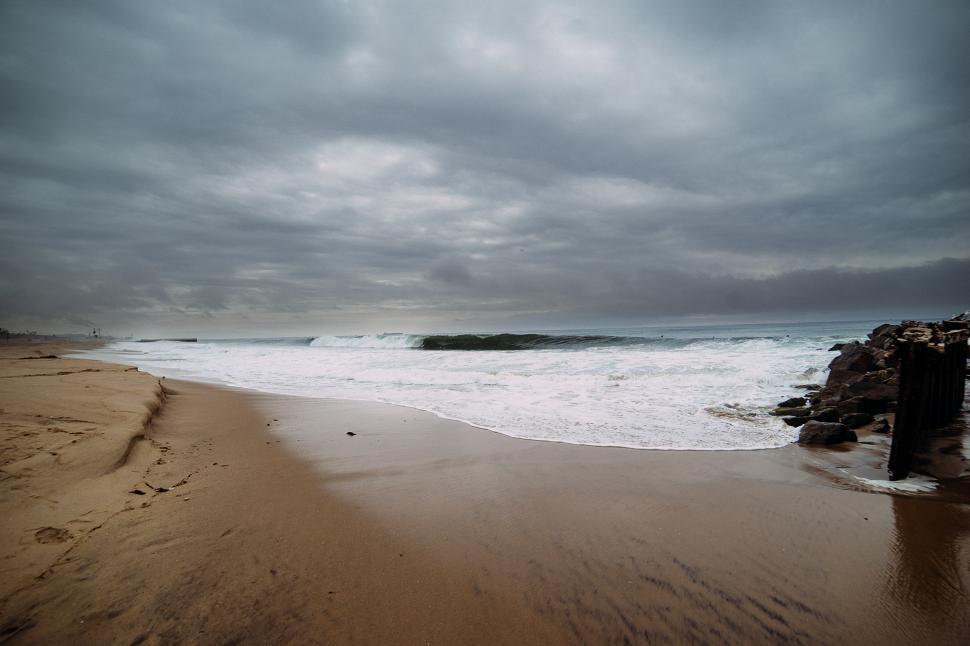 Free Image of Waves Rolling Onto Sandy Beach 
