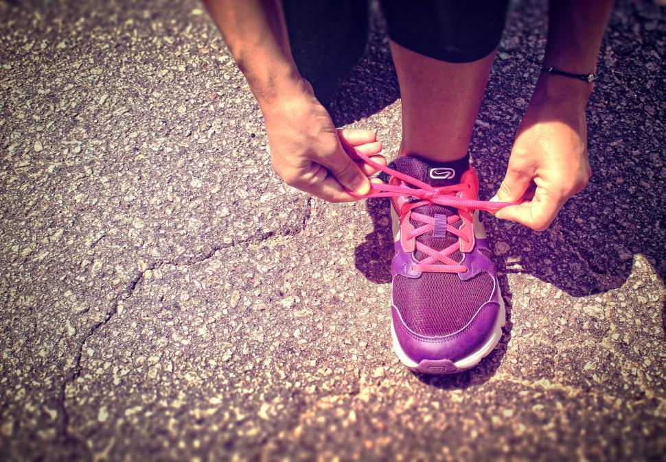 Free Image of Running Shoes - Woman Tying Shoe Laces - Women Health and Fitnes 
