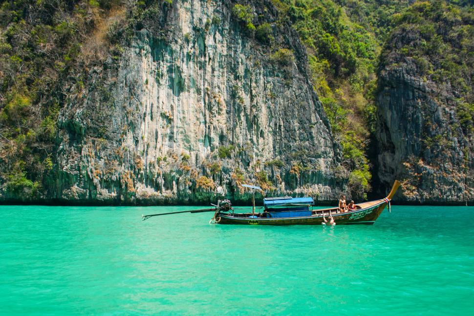 Free Image of Small Boat Floating on Large Body of Water 