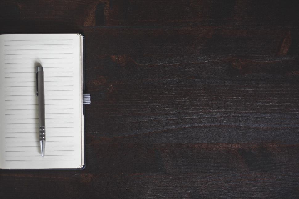 Free Image of Notebook and Pen 