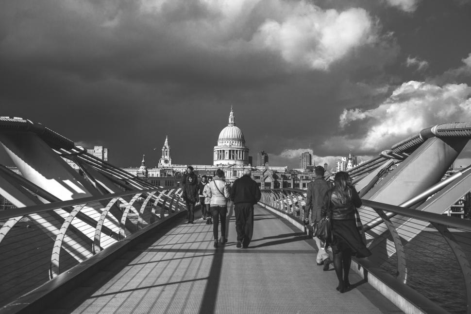Free Image of People Walking Across a Bridge 