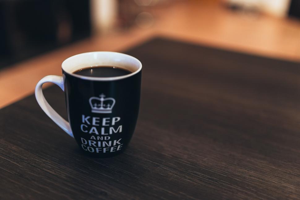 Free Image of A Cup of Coffee on a Wooden Table 