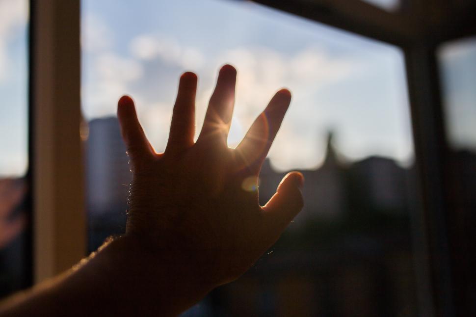 Free Image of Hand Reaching Out of Window 