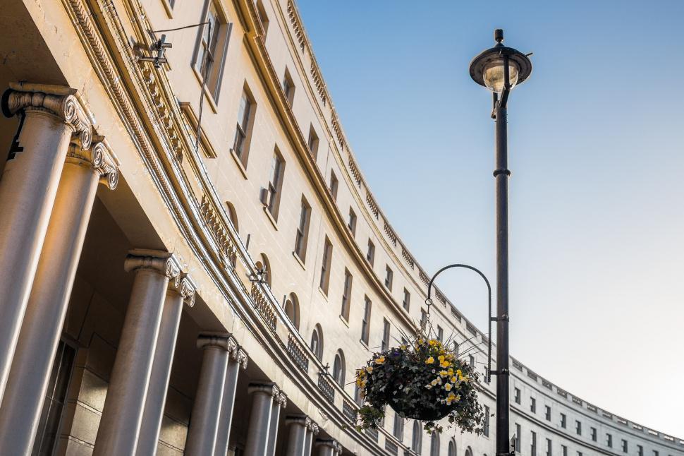 Free Image of Street Light Next to Tall Building 